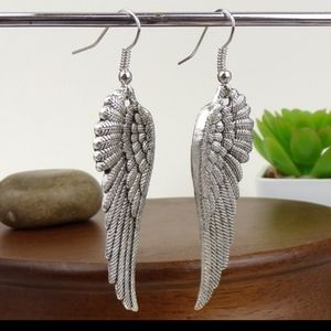 Wing Charm Silver Tone Hook Earrings.